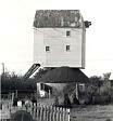 Garboldisham Mill, a mid 18th century post mill. There is a large fantail to the rear of the building.  © Norfolk Museums & Archaeology Service