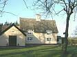 Locks Pyghtle, Mill Road, a 17th century timber framed house with a thatched roof.  © Norfolk Museums & Archaeology Service