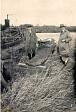 The excavation of a wooden dug-out canoe that was dredged from the River Ant below Wayford Bridge in 1927. At first thought to be medieval, it was later dated to 720 AD.  © Norfolk Museums & Archaeology Service