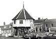 An old photograph of the Market Cross in Wymondham. Probably taken in the 1970s.  © Norfolk Museums & Archaeology Service