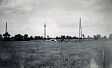 Photograph of three World War Two masts at NHER 40950  © Copyright waived by originator