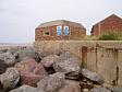 A World War Two pillbox built into the sea wall in Brancaster  © Norfolk Museums & Archaeology Service