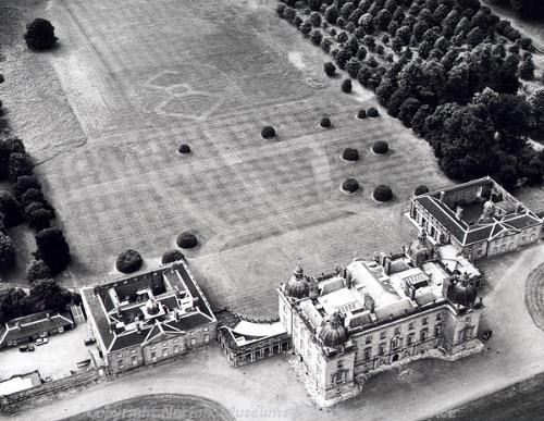 Houghton Hall and surrounding park. Parchmarks of the former garden lay out can be clearly seen behind the hall