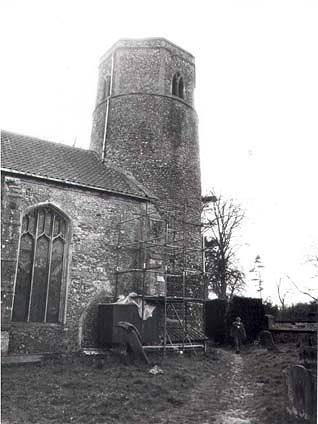 Photograph of St Andrew's Church, Great Ryburgh, an interesting church with very early origins. A round west tower, nave, chancel, north and south transepts and a south porch.