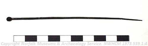 Photograph of a copper alloy Roman cosmetic spoon found during the excavation of a Roman villa in Scole. Photograph from MODES.