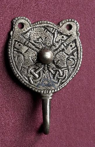 Photograph of a Late Saxon hooked tag decorated in Trewhiddle style from Costessey, Norwich. Photograph from MODES.