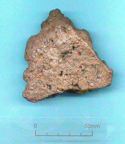Photograph of a Bronze Age bronze ingot found in a hoard of objects in Peckover Road, Norwich. Photograph from MODES.