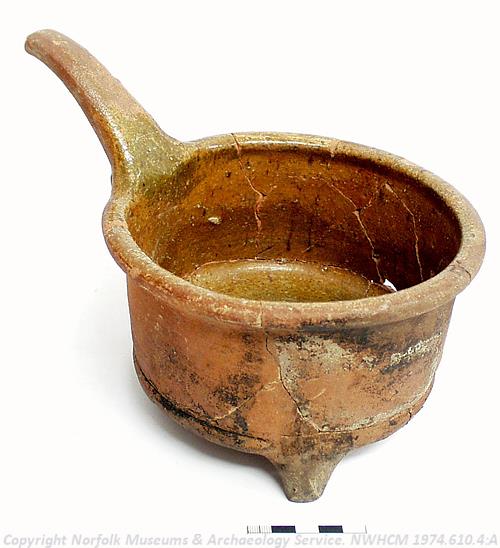 Photograph of a 17th century red earthenware skillet found on Botolph Street, Norwich. Photograph from MODES.