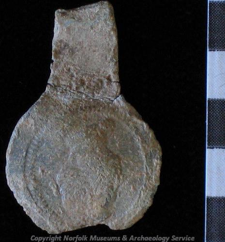 Photograph of a post medieval lead alnage cloth seal from Fincham. Photograph from PAS.