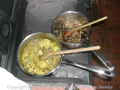 Photograph of Roman cooking during Archaeology Week 2006 at Gressenhall Farm and Workhouse.