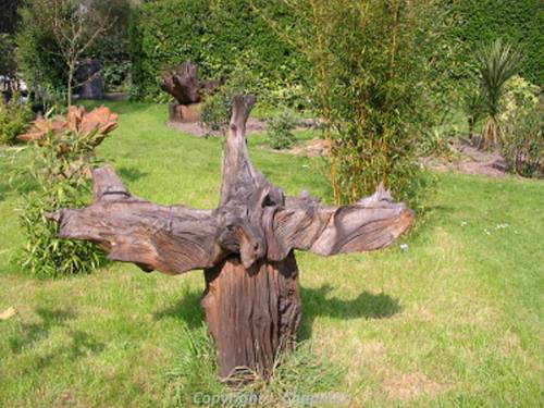 Photograph of Jonathan Chapman's installation in East Ruston Old Vicarage garden. Artwork based on the central stump of Seahenge at Holme-next-the-Sea.