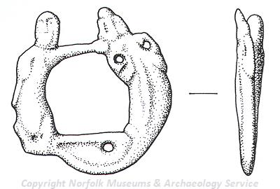 Medieval annular brooch in the form of a figure holding a beast by the mouth/snout.