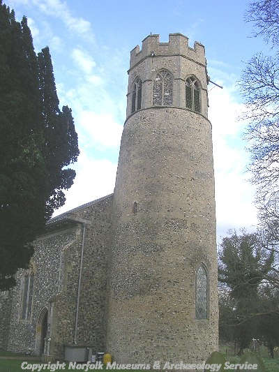 The 11th or 12th century round tower of St Mary's Church, with the 14th century belfry.