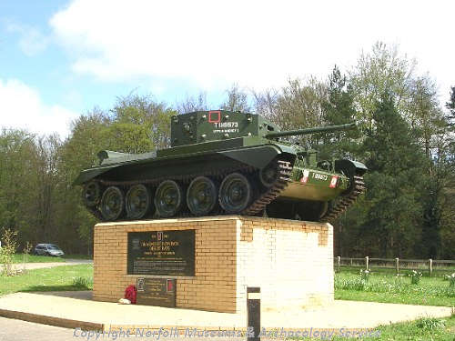 A war memorial with a World War Two Cromwell tank on the site of High Ash training camp.